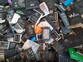 BANGKOK, THAILAND - June 13, 2020 A lot of used mobile phone batteries many different brands that are damaged or worn down.