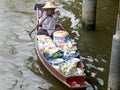 BANGKOK, THAILAND- JUNE, 23, 2017: overhead shot of a woman paddling a boat at damnoen saduak floating market Royalty Free Stock Photo