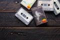 Bangkok, Thailand - June,23 2021 : 90`s cassette tapes of The Beatles, John Lennon on a black wooden floor