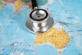 Stethoscope on Australia world globe map background