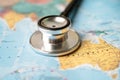 Stethoscope on USA Australia world globe map background