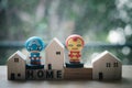 Bangkok, Thailand - June 9, 2020: Superhero with miniature wood home. Concept of hero at home