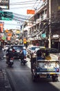 BANGKOK, THAILAND - 10 JUNE, 2015: Traffic in a small street wit Royalty Free Stock Photo