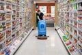 BANGKOK, THAILAND - JUNE 16: Unnamed Foodland supermarket employee cleans the floor with a machine in Bangkok on June 16, 2019