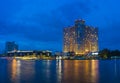 Bangkok, Thailand - June 28, 2015: Wide exterior view of Sheraton hotel by river in Bangkok at twilight