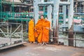 Buddha monks waiting for a boat in Bangkok