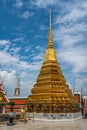 Bangkok, Thailand - Mar 29, 2022: The golden stupa which demons or giants carry on the back at the base, is one of the beautiful Royalty Free Stock Photo