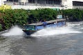 BANGKOK, THAILAND- MAR 1ST: A river taxi speeding along the San