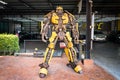 Bangkok, Thailand- March 21, 2021 : Bumblebee transformers robot model made from scrap metal Set up a show in front of a car wash