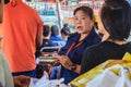 Bangkok, Thailand - March 2, 2017: Cashier of Chao Phraya Express boats is selling tickets and collect money from the passengers.