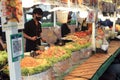 Bangkok, Thailand:March5,2023-Chefs cooking in the street food shop with defocused group of tourists waiting for the food in