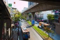 Concrete metro bridge and highway with public bus in downtown of Bangkok city