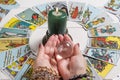 Bangkok,Thailand,March.15.20. A fortune teller holds a magic ball.On the table are fortune-telling cards and lighted candle.Magic