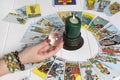 Bangkok,Thailand,March.15.20. A fortune teller holds a magic ball.On the table are fortune-telling cards and lighted candle.Magic