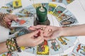 Bangkok, Thailand, March.15.20.A Gypsy woman guesses a love match using wedding rings and fortune-telling cards by candlelight. Royalty Free Stock Photo