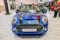 The Mini Convertible is car front with round light and blue and black shiny colors on display at the Department store