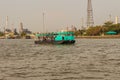 Bangkok, Thailand - March 14, 2017: People are crossing Chao Phraya river from Wat Bang Nam Pheung Nok via ferry service to Wat B Royalty Free Stock Photo