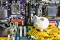 Bangkok, Thailand - March, 22, 2021 :Piggy bank and stack of Bitcoin coins on Computer motherboard .Concept of business and