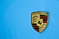 Bangkok, Thailand - March, 31, 2019 : Porsche logo on pastel blue car hood detail with round dark line, view from the top Royalty Free Stock Photo