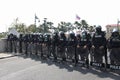 Riot police stand guard with shield to protect the government house Royalty Free Stock Photo