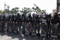 Riot police stand guard with shield to protect the government house Royalty Free Stock Photo