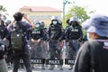 Riot police stand guard with shield to protect the government house Royalty Free Stock Photo