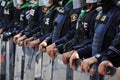 Riot police stand guard with shield to protect the government house Royalty Free Stock Photo