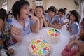 Primary school students organize birthday parties in the school canteen.