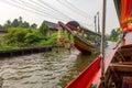 BANGKOK, THAILAND, MARCH, 23, 2018: Unidentified tourists inside of long tail boat with front view sailing at yai canal