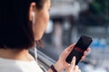 Bangkok, Thailand - March 06, 2019 : women use Netflix app on smart phone screen.