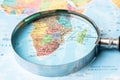 Bangkok, Thailand - May 01, 2022 Africa, Magnifying glass close up with colorful world map