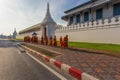 Buddhist monks walking in the Wat Phra Kaew in morning time, Bangkok, Thailand