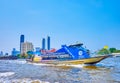 The Chao Phraya River trip with a view on the sailing ferry and the Banyan Tree Riverside Residences in the background, on May 12