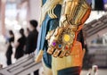 Bangkok, Thailand - May 4, 2019 : A closed up photo of Thanos`s gold gauntlet glove luminous stones. Thanos is a super villain