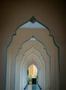 Diminishing perspective interior view of inner Bang O mosque hallway leading into outside building