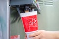 BANGKOK, THAILAND - MAY 10, 2020: 7-Eleven BiG GULP cup gets filled with Coca-cola with a soda machine