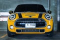 Front view Close up shot of Yellow mini cooper parked in the parking lot Royalty Free Stock Photo