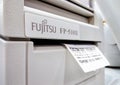 BANGKOK, THAILAND - MAY 03, 2020: Fujitsu Printer Automatically Prints Purchase Receipt