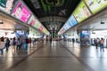 An interior picture inside BTS Skytrain at Siam Square Station with many people