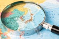 Bangkok, Thailand - May 01, 2022 Japan, Magnifying glass close up with colorful world map