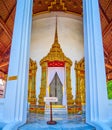 The main door with spire-shaped golden ornament of Ho Phra Monthiantham temple in Grand Palace complex, on May 12 in Bangkok,
