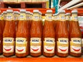 Many bottles of Heinz chili sauce
