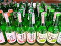 Many bottles of Soju on shelf for sale