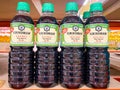 Many bottles of soy sauce on shelf for sale Royalty Free Stock Photo