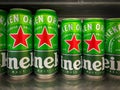 Many cans of Heineken beer on shelf for sale