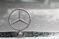 BANGKOK, THAILAND, MAY, 2018: Mercedes Benz logo close up on a car grill in morning after rain. This logo stand on old model of Me