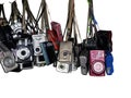 Bangkok, Thailand - May 15, 2018 Old used digital compact cameras of hanging isolated on white
