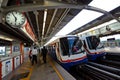 Bangkok, Thailand - May 6, 2011 : People queing, standing in lines waiting and walking into BTS sky train at Mochit station on May