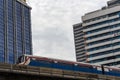 Skytrain Bangkok surrounded by skyscrapers