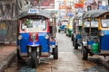 Thailand tuk tuk taxi driving tourists around the city street